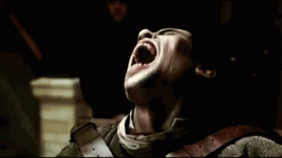 A Close Up Of A Man With His Mouth Open Showing His Teeth GIF