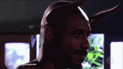A Close Up Of A Man With Horns And The Hashtag Caminho De Coração194 On The Bottom GIF