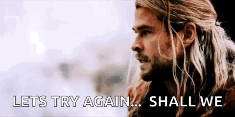 A Close Up Of A Man With Long Hair And A Beard . GIF