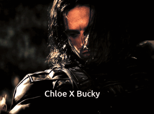 A Close Up Of A Man With Long Hair And The Name Chloe X Bucky GIF