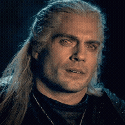 A Close Up Of A Man With Long White Hair GIF