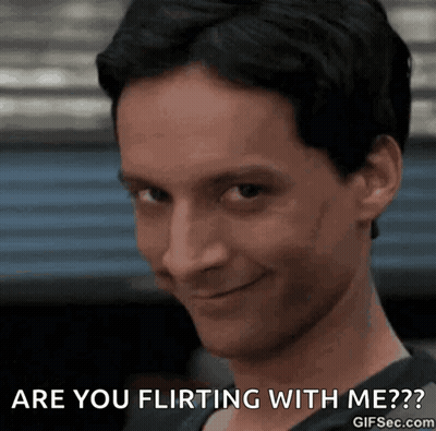 A Close Up Of A Man With The Words Are You Flirting With Me GIF