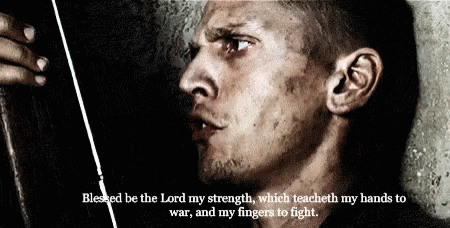 A Close Up Of A Man With The Words Blessed Be The Lord My Strength GIF
