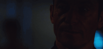 A Close Up Of A Man With The Words I Like To Think It Makes Me Mysterious GIF