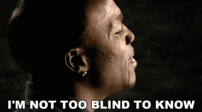 A Close Up Of A Man With The Words I 'M Not Too Blind To Know Below Him GIF