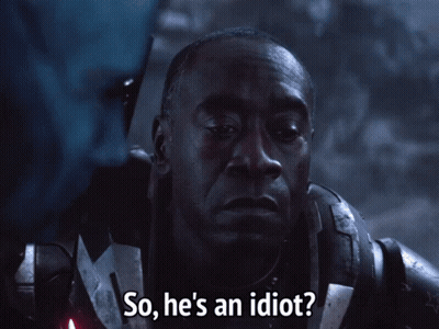 A Close Up Of A Man With The Words So He 'S An Idiot GIF