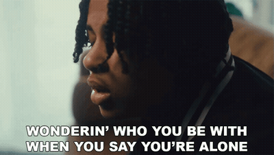 A Close Up Of A Man With The Words Wonderin Who You Be With When You Say You 'Re Alone GIF
