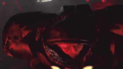 A Close Up Of A Metal Object With Flames Coming Out Of It 'S Mouth . GIF