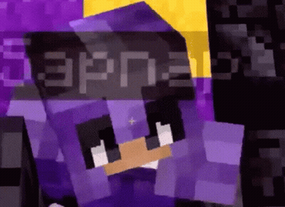 A Close Up Of A Minecraft Character With A Purple Hoodie On GIF