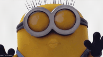 A Close Up Of A Minion 'S Face With The Words I Amdio Young Below It GIF