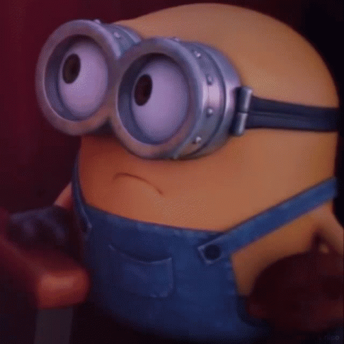 A Close Up Of A Minion Wearing A Pair Of Goggles GIF