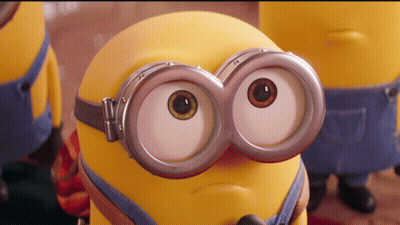 A Close Up Of A Minion Wearing Goggles And Making A Face GIF
