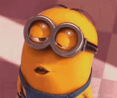 A Close Up Of A Minion Wearing Goggles And Making A Face . GIF