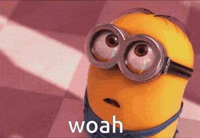 A Close Up Of A Minion Wearing Goggles And The Word Woah GIF