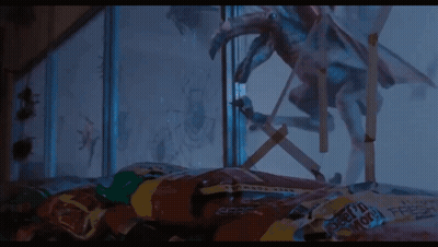 A Close Up Of A Monster Flying Through The Air . GIF