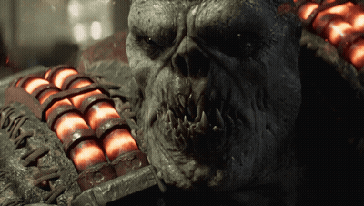 A Close Up Of A Monster 'S Face With A Bunch Of Red Balls In The Background GIF