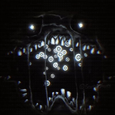 A Close Up Of A Monster 'S Face With A Lot Of Eyes Coming Out Of It 'S Mouth . GIF