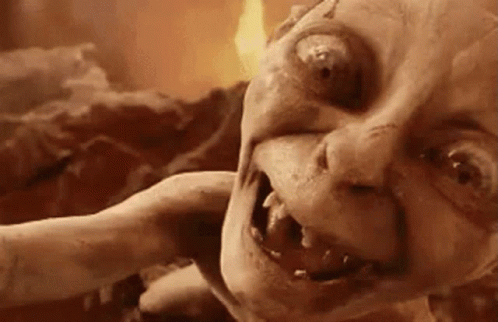 A Close Up Of A Monster 'S Face With Fire In The Background GIF