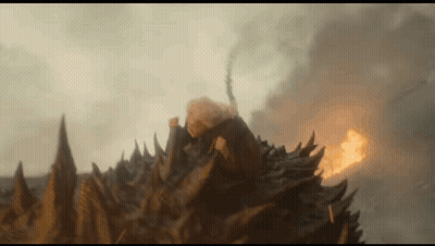 A Close Up Of A Monster 'S Head With Flames Coming Out Of It 'S Mouth GIF