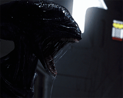 A Close Up Of A Monster 'S Head With Its Mouth Open GIF