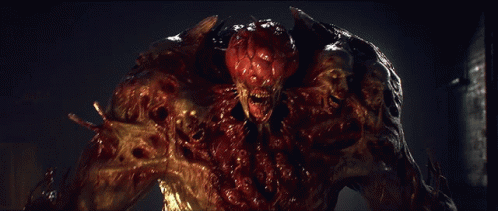 A Close Up Of A Monster With Blood Coming Out Of It GIF