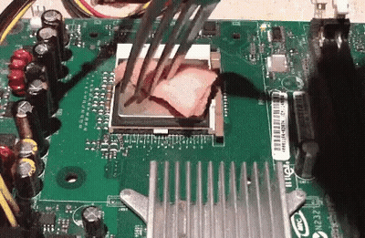 A Close Up Of A Motherboard With A Cpu Being Removed GIF