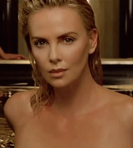 A Close Up Of A Naked Woman 'S Face Looking At The Camera GIF