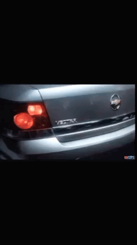 A Close Up Of A Nissan Car With A Black Background GIF