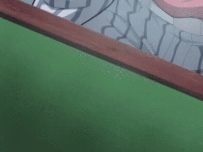 A Close Up Of A Pair Of Ice Cream Sticks On A Green Surface . GIF