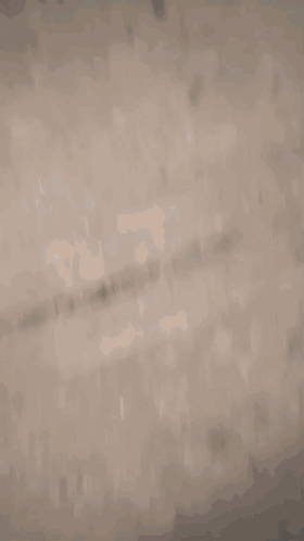 A Close Up Of A Pair Of White And Black Sneakers On A Concrete Floor . GIF