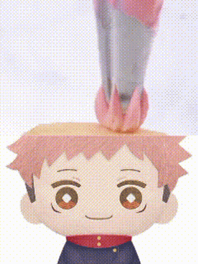 A Close Up Of A Paper Doll With A Rocket On His Head . GIF
