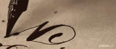 A Close Up Of A Pen Writing The Word Love GIF