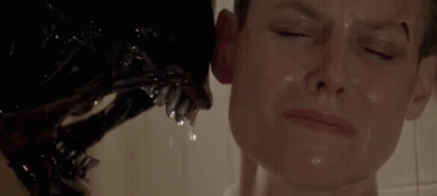 A Close Up Of A Person Being Attacked By A Monster In A Shower . GIF