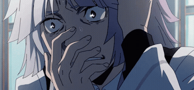 A Close Up Of A Person Covering Their Face With Their Hands GIF