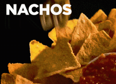 A Close Up Of A Person Eating Nachos With A Black Background GIF