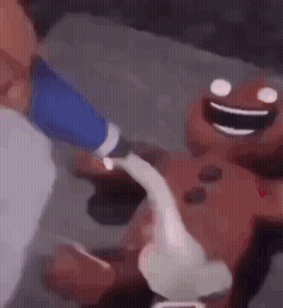 A Close Up Of A Person Holding A Cartoon Character 'S Hand . GIF
