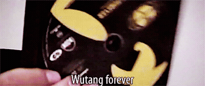 A Close Up Of A Person Holding A Cd That Says Wutang Forever GIF