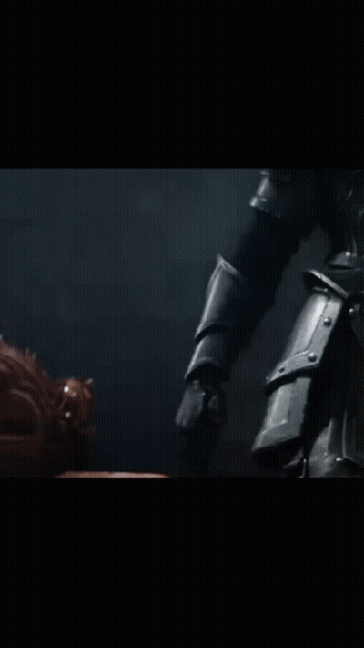 A Close Up Of A Person Holding A Gun In A Dark Room GIF