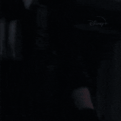 A Close Up Of A Person Holding A Gun With Disney + Written On The Bottom GIF