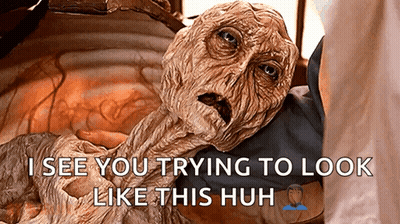 A Close Up Of A Person Holding A Monster With The Caption I See You Trying To Look Like This Huh GIF