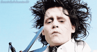 A Close Up Of A Person Holding A Pair Of Scissors With The Words " There Is In The Darkness Tumblr " Above Them GIF