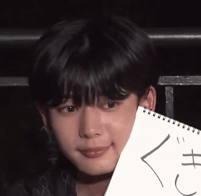 A Close Up Of A Person Holding A Piece Of Paper That Says ' X ' On It GIF