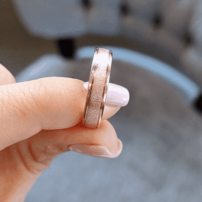 A Close Up Of A Person Holding A Ring GIF