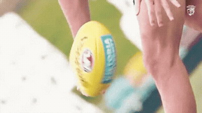 A Close Up Of A Person Holding A Soccer Ball With A Sticker That Says ' Sydney ' On It GIF