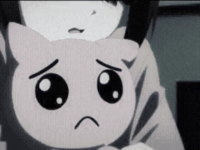 A Close Up Of A Person Holding A Stuffed Animal With A Sad Face . GIF