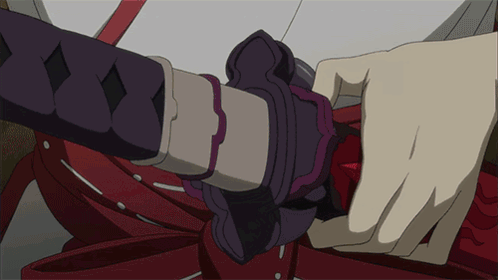 A Close Up Of A Person Holding A Sword In Their Hand GIF