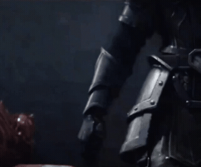 A Close Up Of A Person Holding A Sword In Their Right Hand GIF