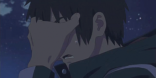 A Close Up Of A Person Holding Another Person 'S Hand To Their Face . GIF