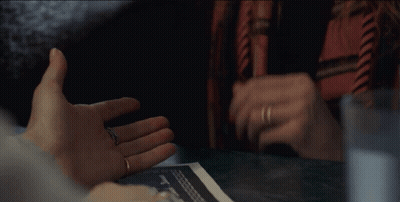 A Close Up Of A Person Holding Another Person 'S Hands GIF
