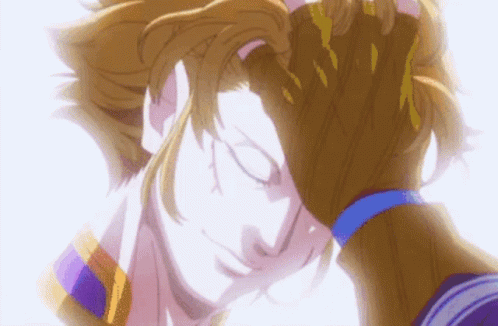 A Close Up Of A Person Holding Another Person 'S Head With Their Eyes Closed . GIF